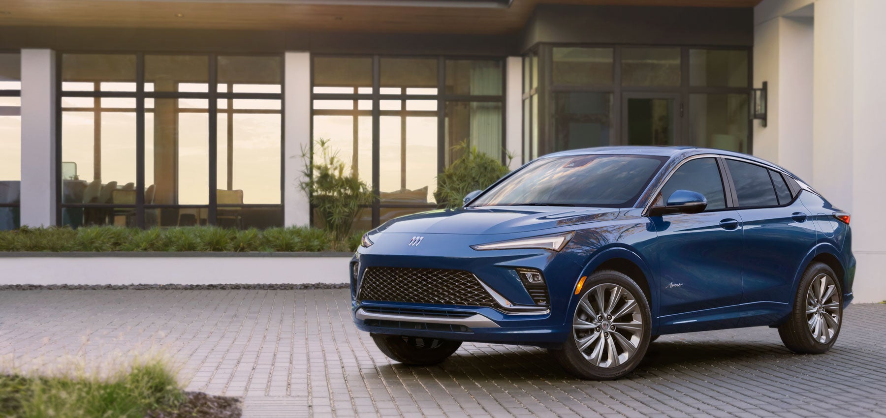 Buick Envista in front of a home - Finnegan Chevrolet Buick GMC in Rosenberg TX