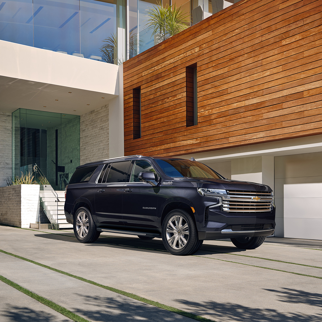 Chevy Suburban parked in front of house