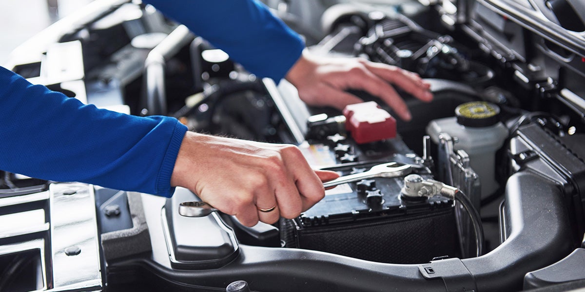 Service Technician working on an engine - Finnegan Chevrolet Buick GMC in Rosenberg TX