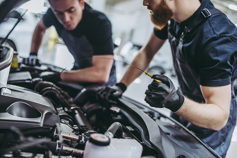 Mechanics working vehicles - Finnegan Chevrolet Buick GMC in Rosenberg TX