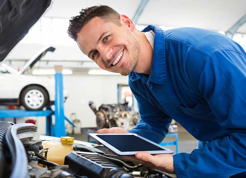 Service Technician smiling - Finnegan Chevrolet Buick GMC in Rosenberg TX